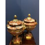 Pair of marble & gilt metal mounted urns in the Neo classical taste with lion mask head handles &