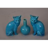 Pair of C19th/20th Chinese turquoise cats, 16cm high, together with a turquoise bottle vase. (2)