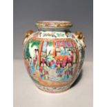 Chinese Cantonese export famille rose vase with mask ring handles, the sides painted with