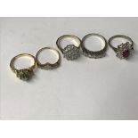 Two cubic zirconia rings, and a garnet and diamond red ring on silver gilt shank, an 18carat gold