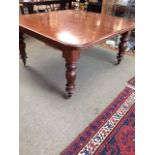 Victorian heavy mahogany extending dining table on fluted legs & brass castors, 137x137cm closed (
