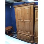 Pine double wardrobe with panelled doors & drawer beneath, 112cmW