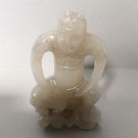 Chinese jade carving of a horned man in seated pose 7cmH