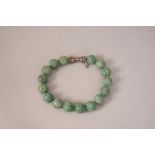 Chinese carved jade 'dragon' beads necklace.