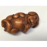 Japanese carved Netsuke in the form of a dog