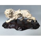 Early C20th ivory okimono of a lion with cub & bird, signed