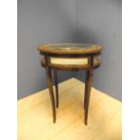 Mid-Victorian oval bijouterie table, the glazed hinged top over glazed panel sides, on slender