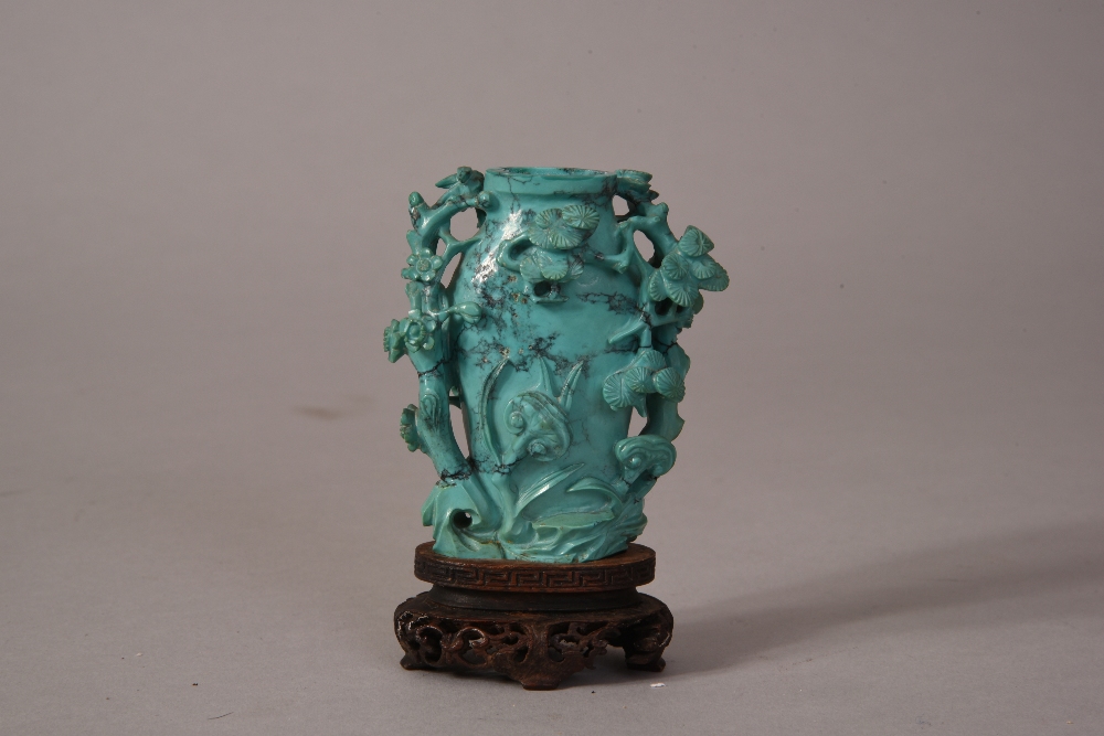 Chinese carved turquoise vase in the form of 'three friends', Qing dynasty, wood stand, overall 9.