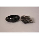 Two Chinese dark green jade brush pots, one carved as lotus leaf-form 7cm wide, and the other with