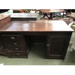 Stained pine writing desk of 4 long drawers with an opposing cupboard 137 cm W