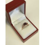 14 ct rose gold garnet and white sapphire dress ring