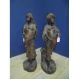 Pair of C19th Continental Eastern water carrier figures of lady and gentleman, 72cmH