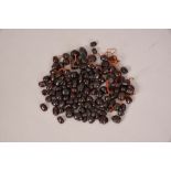 A group of garnet beads.