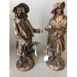 After E. BLAVIER, pair of bronze farm labourer figures, each with implement in hand, signed, 43cmH