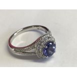 18ct white gold tanzanite and diamond halo style ring of 1.6cts