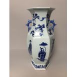 C20th Chinese porcelain hexagonal twin handle vase decorated with figures, clouds and birds 41cmH