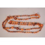 Amber necklace composed of oval amber beads and spaced by seven large amber beads