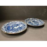 Pair of C18th Delft tin glazed blue and white dishes decorated with ferns and foliage 24 cm dia