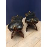 Pair of Eastern hardwood camel stools with leather seats