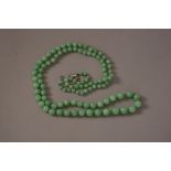 Chinese jadeite beads and diamond necklace, 84cm long.