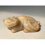 Chinese orange tinted jade carving of a mythical beast in recumbent pose 9cmL