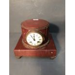 C19th French rouge marble mantle clock, the circular dial with 8 day movement striking a bell