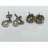 Pair of yellow metal and aquamarine stud earrings & a pair of pearl stud earrings with small diamond