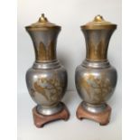 Pair of Chinese tin and brass table lamps with floral & bird decoration on wooden stands