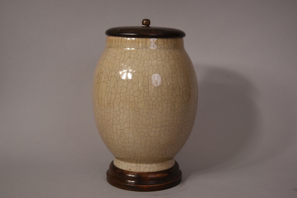 C18th/19th Chinese crackle glazed ovoid jar, wood cover and stand, overall 31cmH