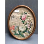 Chinese oval painting on silk depicting flowers and butterflies