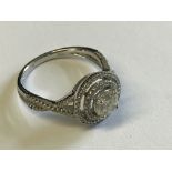 18 carat white gold & diamond halo style ring of 1.2 carats