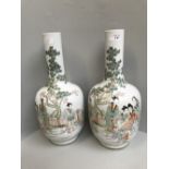 Pair of early C20th Chinese porcelain famille verte vases, decorated with figures amidst trees, with