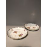 Pair of Vienna porcelain floral decorated dishes with gilt scalloped rims, 21cm dia