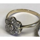 18 carat gold, daisy style, 7 stone diamond petal ring