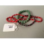 Chinese green bead bangle, another & a red bead necklace