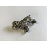 Silver brooch in the form of a dog with glass eye
