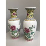 Pair of Chinese porcelain Rouleau vases, floral decoration with imperial yellow neck, signed,