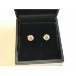 Pair of 14 carat white gold & diamond stud earrings of 1.5 carats approx.