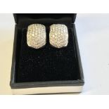 Pair of 18 carat white gold pave set diamond earrings of 3 carats