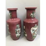 Pair of Chinese Rouleau vases decorated with landscapes & vases on a peach ground, 6 character marks