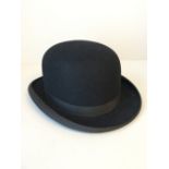 Black bowler hat by Dunn & Co, London (please remember to check condition of lots before bidding