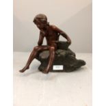 Bronze boy with a basket sitting on rock signed 20cm H (please remember to check condition of lots