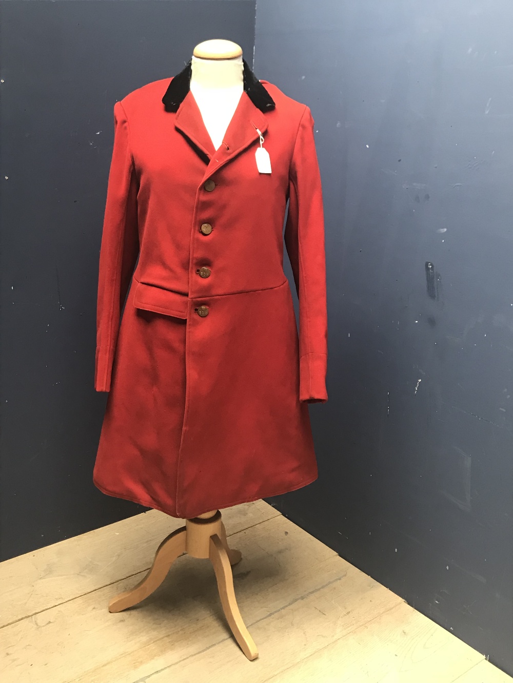 Vintage gentleman's red hunting coat, traditional long length, with black velvet collar, and brass