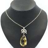 18ct white gold substantial citrine of 30cts with diamond bow to the bail