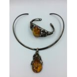 White metal amber torque pendant with matching bangle bracelet