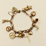 9ct gold charm bracelet set with 9ct & yellow metal charms 28g