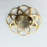 9ct Rose gold openwork brooch set in oval free cut smokey quartz 5.9g