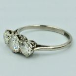 Platinum & diamond 3 stone ring, central diamond approx 0.7cts size O 3.3g