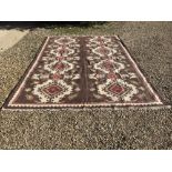 Large Oka wool rug with geometric pattern on a brown background 365x254cm