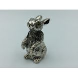 Silver figure of a rabbit with glass eyes